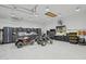 Garage with ATV's, tool storage, and TV at 3939 W Fox Rd, Laveen, AZ 85339
