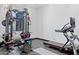 Home gym features treadmill and weight lifting equipment at 3939 W Fox Rd, Laveen, AZ 85339