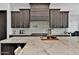A large kitchen island with light countertops and lots of space for cooking and entertaining at 3939 W Fox Rd, Laveen, AZ 85339