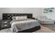 Main bedroom with large platform bed and a comfortable seating area at 3939 W Fox Rd, Laveen, AZ 85339
