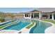 Gorgeous backyard pool featuring a unique design with turf accents surrounding the water, plus a stunning mountain view at 3939 W Fox Rd, Laveen, AZ 85339