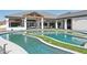 Stunning pool with turf details and a unique design, providing a serene outdoor retreat with a beautiful mountain backdrop at 3939 W Fox Rd, Laveen, AZ 85339