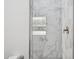 Shower features marble tile with tiled recessed shelving at 3939 W Fox Rd, Laveen, AZ 85339