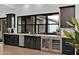 This wet bar features built in cabinetry, plenty of storage, and a great view outside at 3939 W Fox Rd, Laveen, AZ 85339