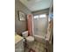 Bathroom with a tub-shower combo, white tile, and a neutral color scheme at 50 W Calle De Arcos --, Tempe, AZ 85284