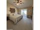 Bedroom with sliding glass door, backyard access, and ceiling fan for a cool breeze at 50 W Calle De Arcos --, Tempe, AZ 85284