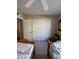 This is a bedroom with two twin beds, closet, and window at 50 W Calle De Arcos --, Tempe, AZ 85284