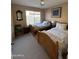 Bedroom with two twin beds, ceiling fan and a view out to the backyard at 50 W Calle De Arcos --, Tempe, AZ 85284