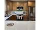This kitchen features a large island, stainless steel appliances, and wooden cabinets at 50 W Calle De Arcos --, Tempe, AZ 85284