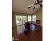 Sunny living room featuring a sliding glass door, hardwood floors, and backyard views at 50 W Calle De Arcos --, Tempe, AZ 85284