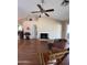 Hardwood floors, fireplace, ceiling fan, and natural light create an inviting living space at 50 W Calle De Arcos --, Tempe, AZ 85284