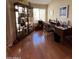 Bright home office featuring hardwood floors, a large window, and a classic desk with plenty of natural light at 50 W Calle De Arcos --, Tempe, AZ 85284