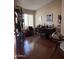 Bright home office featuring hardwood floors, a large window, and a classic desk with plenty of natural light at 50 W Calle De Arcos --, Tempe, AZ 85284