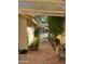Charming outdoor patio area with brick pavers, lush greenery, and comfortable seating under a pergola at 50 W Calle De Arcos --, Tempe, AZ 85284