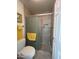 Modern bathroom showcasing a tiled shower with a glass door and built-in niche at 50 W Calle De Arcos --, Tempe, AZ 85284