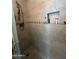 Detailed shot of tiled shower showing adjustable shower head and built-in niche at 50 W Calle De Arcos --, Tempe, AZ 85284