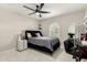 Stylish bedroom with decorative window, accent wall, ample closet space, and luxury vinyl flooring for modern appeal at 5129 W Echo Ln, Glendale, AZ 85302