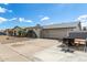Front exterior of home with concrete driveway and desert landscaping at 5129 W Echo Ln, Glendale, AZ 85302