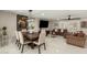 Open-concept living spaces featuring a modern table, stylish decor, and seamless flow to the living room at 5129 W Echo Ln, Glendale, AZ 85302
