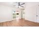 This bedroom features new hardwood floors, sliding glass doors, and mirrored closet at 5607 N 76Th Pl, Scottsdale, AZ 85250
