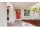 The front entrance has a red door and tile landing at 5607 N 76Th Pl, Scottsdale, AZ 85250