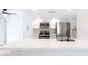 Bright kitchen with white cabinets, quartz countertops, and stainless steel appliances at 5607 N 76Th Pl, Scottsdale, AZ 85250