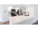 Bright modern kitchen featuring white cabinets, stainless steel appliances, and a quartz countertop at 5607 N 76Th Pl, Scottsdale, AZ 85250