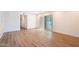This large living room has hardwood floors and sliding glass doors to the exterior at 5607 N 76Th Pl, Scottsdale, AZ 85250