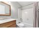 Traditional bathroom showcases a bathtub with shower, a toilet, and a wood vanity at 6514 S Lakeshore Dr # C, Tempe, AZ 85283