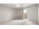 Bright bedroom features a ceiling fan and a sliding glass door with backyard access at 6514 S Lakeshore Dr # C, Tempe, AZ 85283