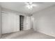 This bedroom features an expansive closet with shelving for optimal storage solutions at 6514 S Lakeshore Dr # C, Tempe, AZ 85283