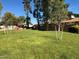 Expansive green community park with mature trees and manicured lawns offering a peaceful setting for recreational activities at 6514 S Lakeshore Dr # C, Tempe, AZ 85283
