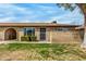 Charming single-story home with well-maintained lawn and desert landscaping, featuring a brick facade and arched entryway at 6514 S Lakeshore Dr # C, Tempe, AZ 85283