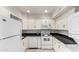 White kitchen features essential appliances and ample storage at 6514 S Lakeshore Dr # C, Tempe, AZ 85283