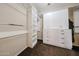 Walk-in closet with custom organizers, shelves, cabinets, and hanging rods at 6796 W Evergreen Ter, Peoria, AZ 85383