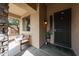 Inviting front porch with a cozy bench and stylish decor, creating a welcoming entrance at 6796 W Evergreen Ter, Peoria, AZ 85383