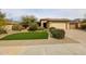 Charming single-story home with manicured landscaping, a well-maintained lawn, and a two-car garage at 6796 W Evergreen Ter, Peoria, AZ 85383