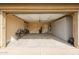 Clean and organized garage with bikes, storage cabinets, and painted floor at 6796 W Evergreen Ter, Peoria, AZ 85383