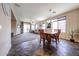 Open floor plan shows living room and dining area with ample windows and natural light at 6796 W Evergreen Ter, Peoria, AZ 85383