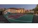 Spacious backyard with basketball court and view of the house at sunset at 7589 W Firebird Dr, Glendale, AZ 85308