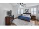 Serene bedroom with shuttered windows, soft rug, and stylish wood furniture at 7844 W Molly Dr, Peoria, AZ 85383