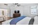 Cozy bedroom featuring modern wood dresser and a plush white rug at 7844 W Molly Dr, Peoria, AZ 85383