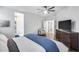 Comfortable bedroom with a large dresser and a view into the bathroom and closet at 7844 W Molly Dr, Peoria, AZ 85383