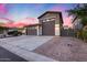 Beautiful exterior view of a home with a two-car garage and a charming driveway at 7844 W Molly Dr, Peoria, AZ 85383