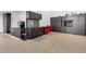 A spacious garage with built-in cabinets, work area, epoxy floors, and ample lighting at 7844 W Molly Dr, Peoria, AZ 85383