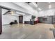 Expansive garage space with custom cabinets, work area, and ample room for vehicles and storage at 7844 W Molly Dr, Peoria, AZ 85383