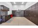 Custom garage with plenty of cabinet storage, workbench, and epoxy flooring at 7844 W Molly Dr, Peoria, AZ 85383
