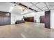 Well-organized garage with custom cabinets providing ample storage and epoxy floors at 7844 W Molly Dr, Peoria, AZ 85383