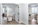 Hallway featuring views into an office, bedroom, and bathroom, creating an open and airy atmosphere at 7844 W Molly Dr, Peoria, AZ 85383