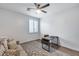 Inviting home office with a large desk, comfortable sofa and shuttered windows at 7844 W Molly Dr, Peoria, AZ 85383